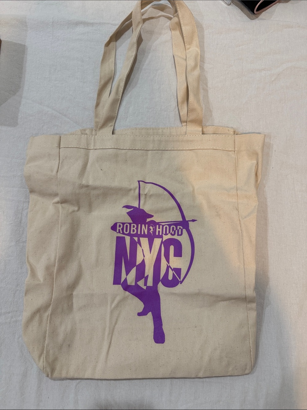 Robin Hood NYC Canvas Tote Bag in Beige with Purple Print